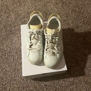 Air Jordan Retro Sneakers in Cream and Gold